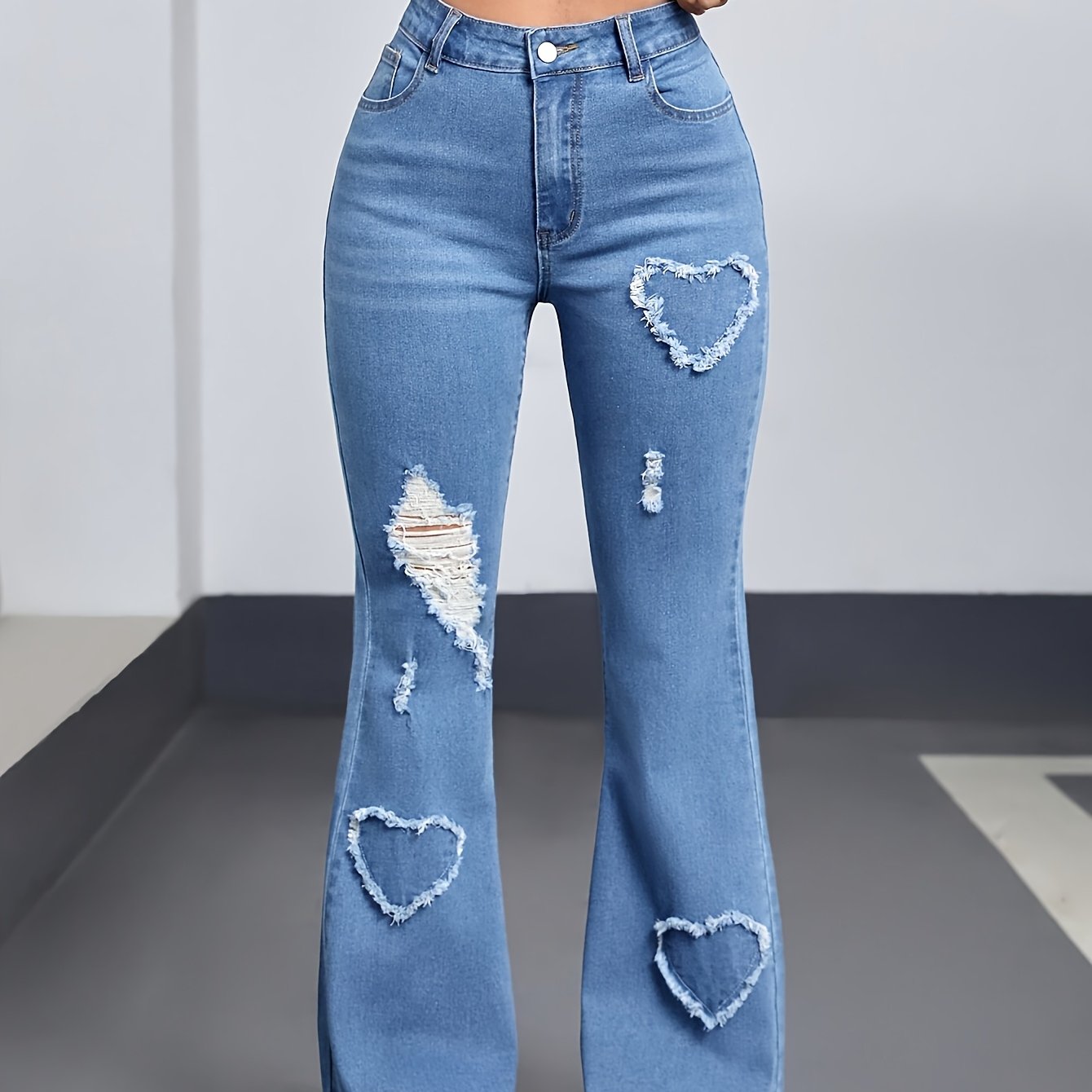 High Waisted Flared Jeans In Light Blue Ripped Denim