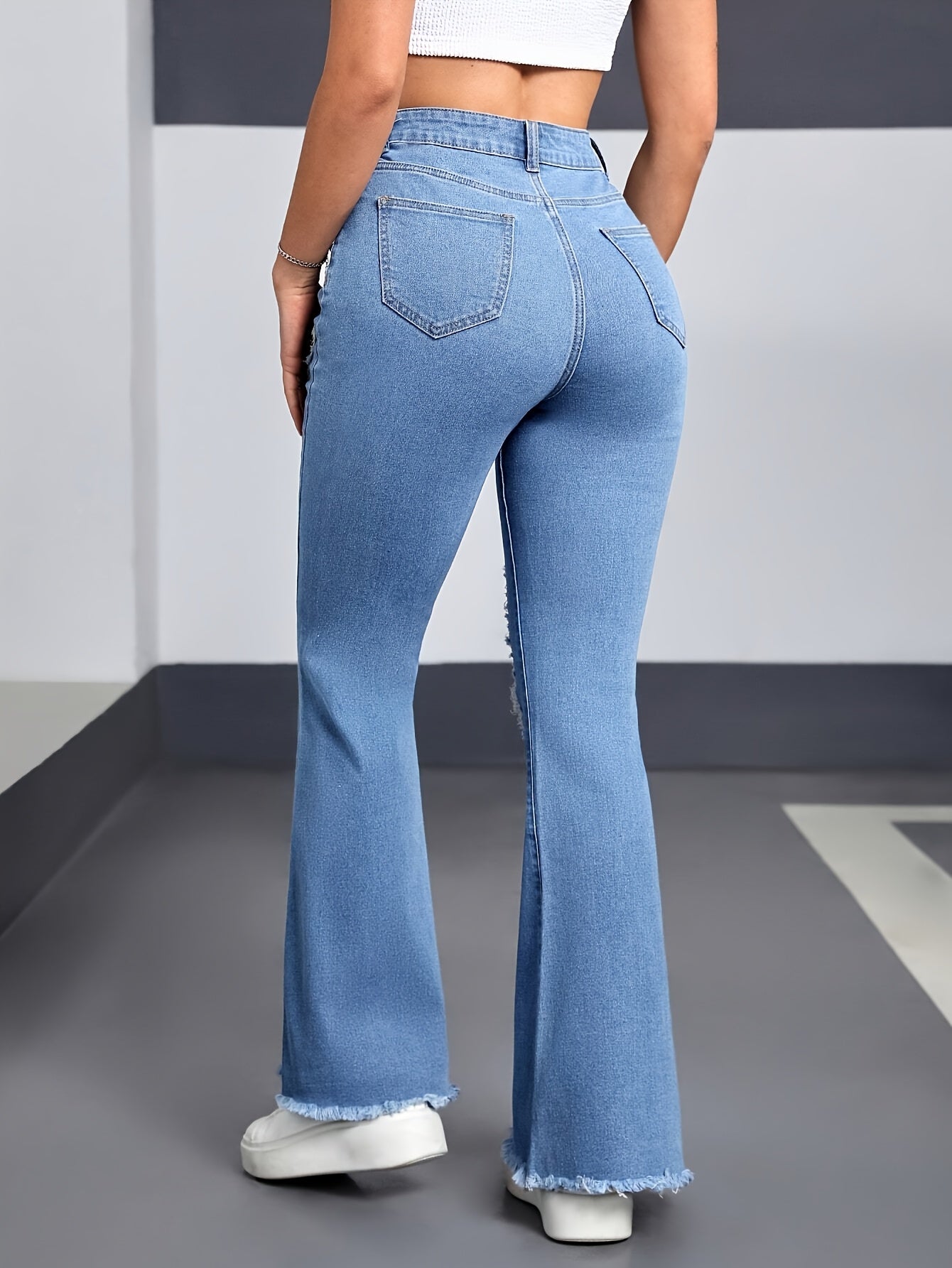 High Waisted Flared Jeans In Light Blue Ripped Denim