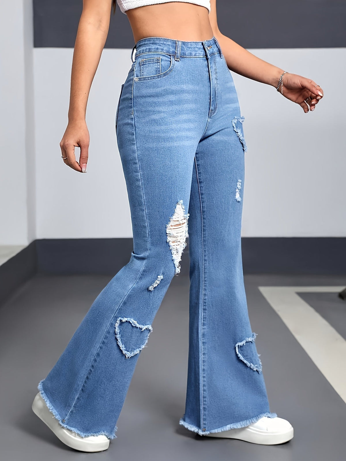 High Waisted Flared Jeans In Light Blue Ripped Denim