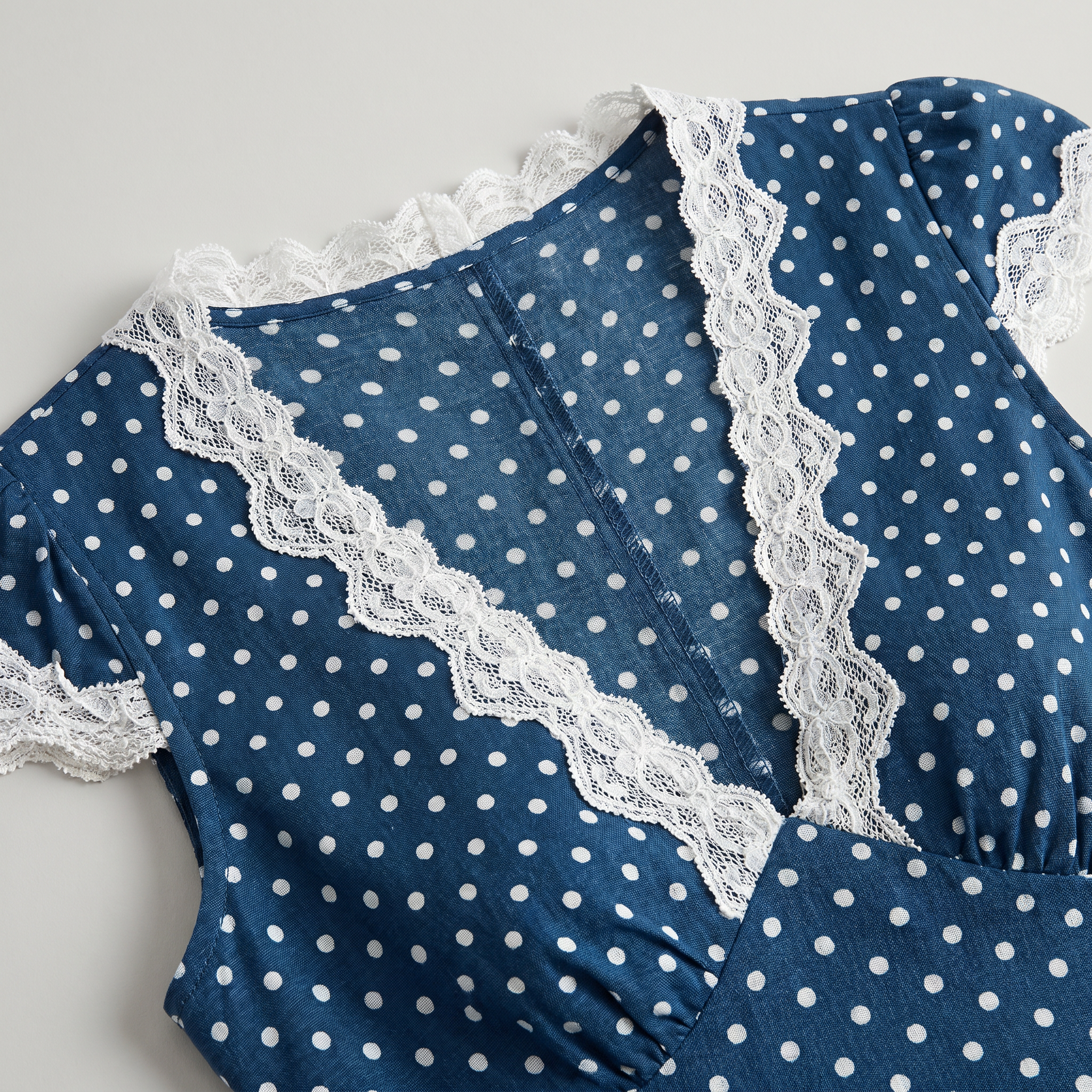 The Navy V Neck Polka Dot Lace Ruched Maxi Dress